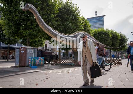 life-size dinosaurs models exhibited at various locations in the city center of Bochum, here: Diplodocus, North Rhine-Westphalia, Germany.  lebensgros Stock Photo