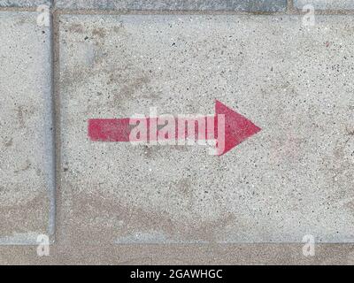 Arrow on walkway beach - Arrow on walkway indicate the way Stock Photo