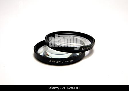 Macro Close-Up Filter Lens,+10, +4, 49mm for dslr camera isolated on white background Stock Photo