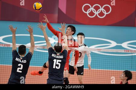 Tokyo, Japan. 01st Aug, 2021. Japan's Yuki Ishikawa spikes the ball over Iran's defenders H. Milad Ebadiipour Ghara (2) and Aliasgher Mojarad during Men's volleyball competition at the Tokyo 2020 Olympics, Sunday, August 1, 2021, in Tokyo, Japan. The match went to five sets, Japan winning 25-21, 20-25, 29-31, 25-22 and 15-13. Photo by Mike Theiler/UPI Credit: UPI/Alamy Live News Stock Photo