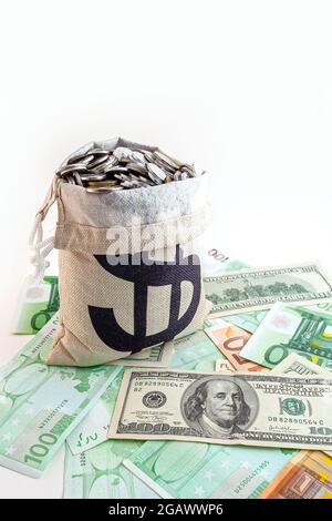 pouch with coins and bitcoins on us dollar and euro banknotes Stock Photo