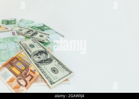 panorama US dollars banknotes, euro banknotes on an isolated white background Stock Photo