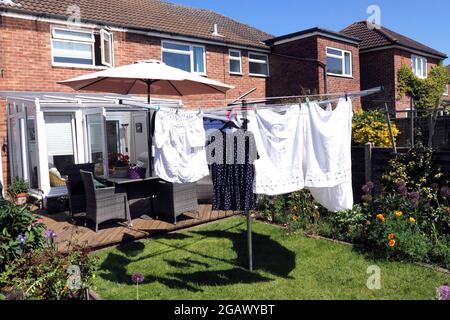 CLEAN LAUNDRY DRYING ON A WASHING LINE Stock Photo