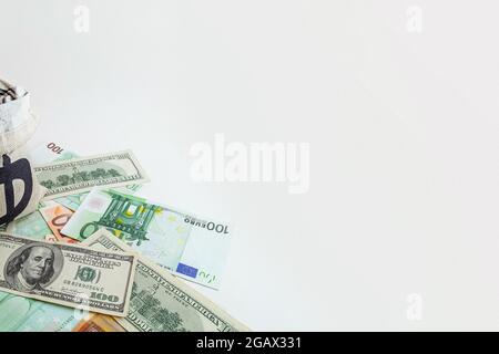 panorama pouch with coins and bitcoins on us dollar and euro banknotes Stock Photo