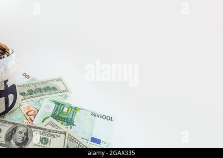 panorama pouch with coins and bitcoins on us dollar and euro banknotes Stock Photo