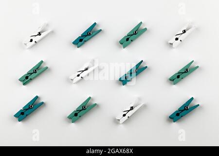clothes pins pattern on white background. multi-colored clothespins isolated Stock Photo