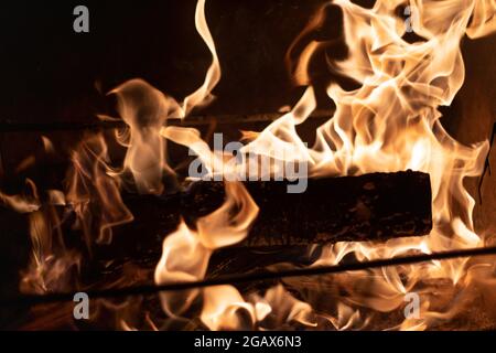 BBQ Fireplace Traditional Cooking on Open Fire Burning Firewood in the Brazier Stock Photo