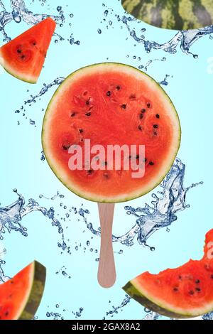 Watermelon slice on ice cream stick  and watermelon cut into pieces flying in the air. Floating, flying, levitating sliced fresh watermelon with splas Stock Photo