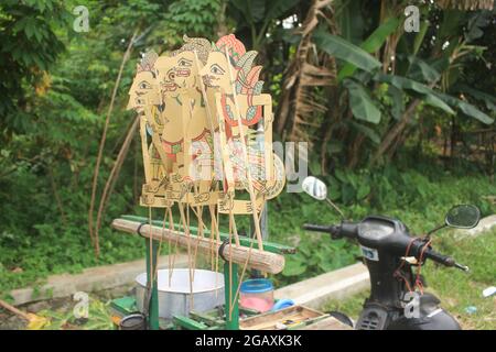 A handcrafted leather puppet decoration from Indonesia, wayang is a native Indonesian art and has been registered as a world heritage by UNESCO Stock Photo