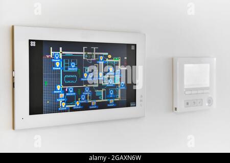 Concept of automation system smart modern luxury wealthy home mounted on white wall close up, no people Stock Photo