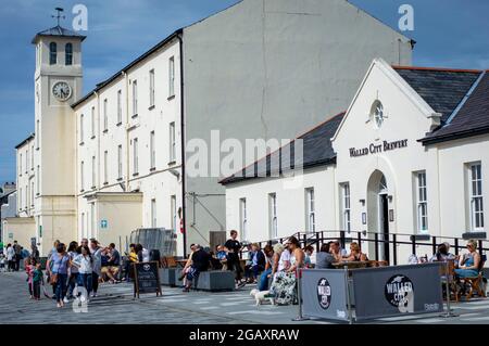 Derry, Northern Ireland, July, 2016. People enjoy the time at Derry city Ebrington Square in a sunny day. Stock Photo