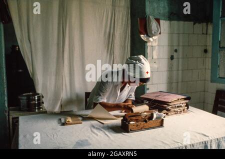 Research staff studying the effects of Agent Orange at the Vietduc Hospital, Hanoi. It was here that Professor Ton Tach Tung's research work uncovered the many birth defects caused by Agent Orange. June 1980 Stock Photo