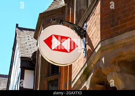Chester, Cheshire, England - July 2021: Sign above the entrance to the branch of HSBC Bank in the city centre Stock Photo