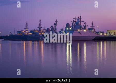 KRONSTADT, RUSSIA - JULY 27, 2019: Warships of the Baltic Fleet in Middle Harbor on July twilight Stock Photo