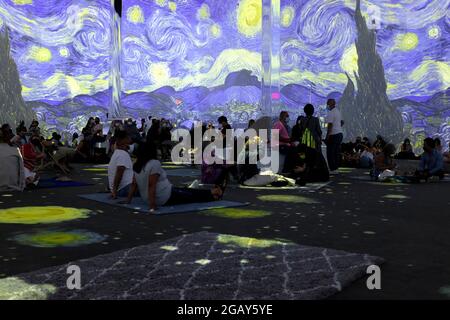 Patrons inside the Vincent Van Gogh Immersive Experience in New York City Stock Photo