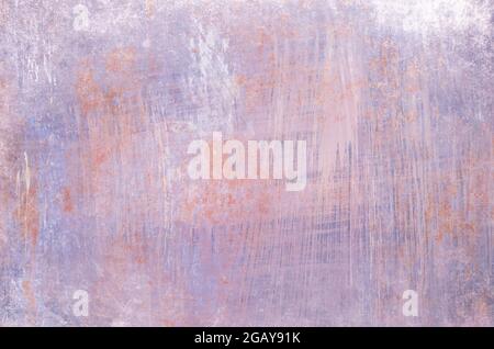 Old worn out rusty metallic sheet with pastel mauve peeling paint, grunge background or texture Stock Photo