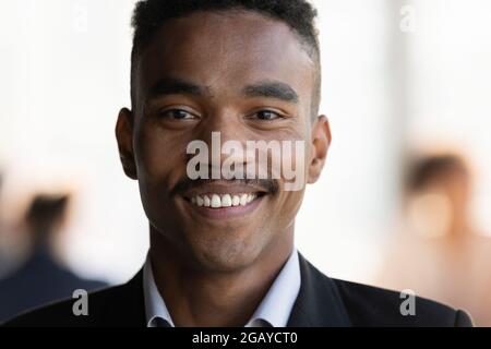 Portrait of smiling young 30s african american businessman. Stock Photo
