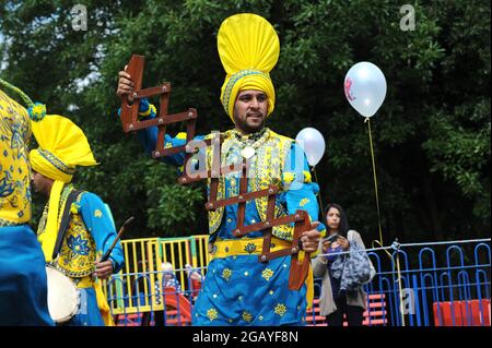 Bhangra dancers playing Saap performing in West Bromwich, Sandwell, West Midlands, Britain, Uk Stock Photo