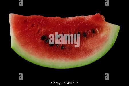 Piece of ripe watermelon on black background isolated Stock Photo