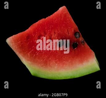 Piece of ripe watermelon on black background isolated Stock Photo