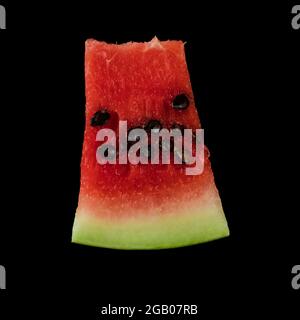 Piece of ripe watermelon on black background isolated Stock Photo