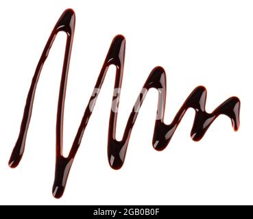 Chocolate syrup drizzle isolated on white background. Splashes of sweet chocolate sauce. Top view. Stock Photo