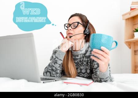 Inspiration showing sign Web Development. Business idea work involved in developing a website for the Internet Callcenter Agent Working From Home Stock Photo