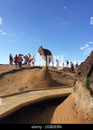 New Taipei, Taiwan - July 6, 2015: View of people attraction to Queen's head stone at Yehliu Geopark Park in the northern coast of Taiwan. Stock Photo