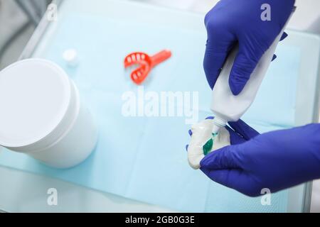 Orthodontist using dental putty to make teeth impressions of a patient  Stock Photo - Alamy