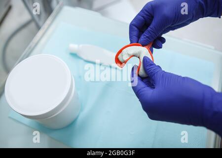 Orthodontist using dental putty to make teeth impressions of a patient  Stock Photo - Alamy