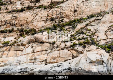 Granite rocks in the Cala Maestra in the isle of Montecristo, in the Tyrrhenian Sea and part of the Tuscan Archipelago. Stock Photo