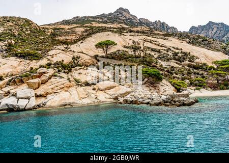 Granite rocks in the Cala Maestra in the isle of Montecristo, in the Tyrrhenian Sea and part of the Tuscan Archipelago. Stock Photo