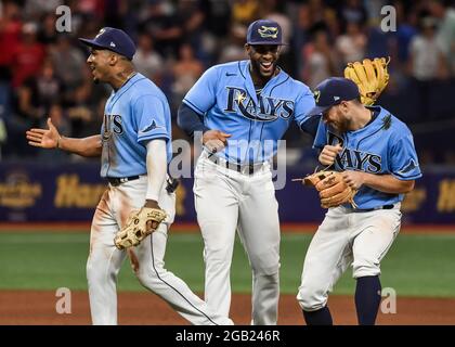 From left to right, Tampa Bay Rays' Joey Wendle, Brett Phillips and Mike  Brosseau wear No. 42 on their jerseys in honor of Jackie Robinson Day  before a baseball game against the