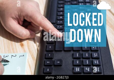 Sign displaying Locked Down. Conceptual photo emergency measure which showing prevented from restricted area Hands Pressing Computer Keyboard Keys