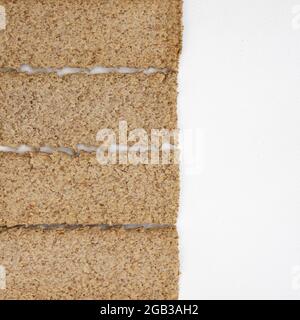 group of light brown multigrain rye crispbreads isolated on white background, bread cracker snacks, top view Stock Photo