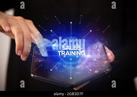 Businessman holding a foldable smartphone, new business concept