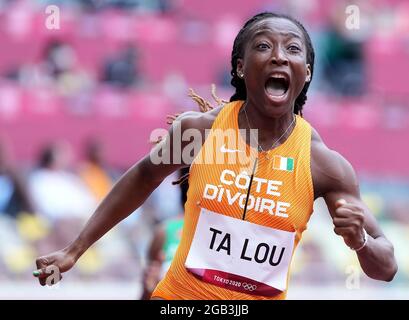 (210802) -- BEIJING, Aug. 2, 2021 (Xinhua) -- Marie-Josee Ta Lou of Cote d'lvoire reacts during the Women's 100m Heat at the Tokyo 2020 Olympic Games in Tokyo, Japan, July 30, 2021. (Xinhua/Lui Siu Wai)