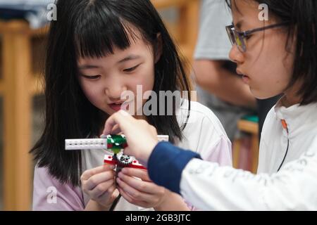 (210802) -- BEIJING, Aug. 2, 2021 (Xinhua) -- Kids play at a daycare classroom at a primary school in Nanjing, east China's Jiangsu Province, July 5, 2021. (Xinhua/Ji Chunpeng)