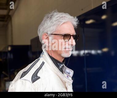 Close-up of Damon Hill OBE, in  Pit Garage 27, at the Silverstone Classic 2021, just before he gave a demonstration of his Championship Winning Williams FW18 Formula One Car