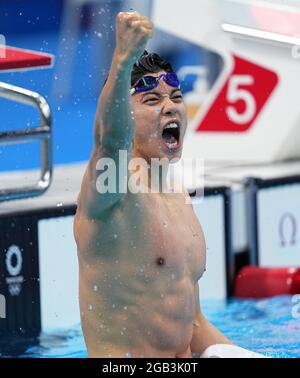 (210802) -- BEIJING, Aug. 2, 2021 (Xinhua) -- Wang Shun of China celebrates after the men's 200m individual medley final of swimming at the Tokyo 2020 Olympic Games in Tokyo, Japan, July 30, 2021. (Xinhua/Xu Chang)