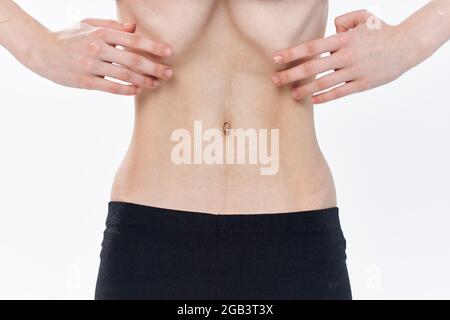 woman with flat stomach health problems anorexia weight loss Stock Photo