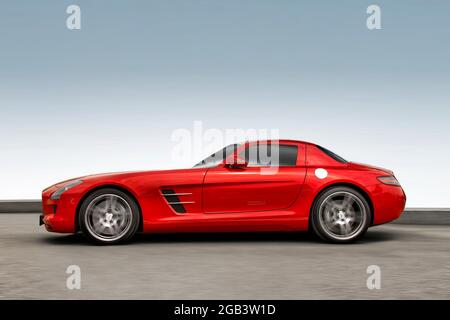 Kiev, Ukraine - May 19, 2020: Red supercar Mercedes-Benz SLS AMG against the sky. Wallpaper. Car in motion. Stock Photo