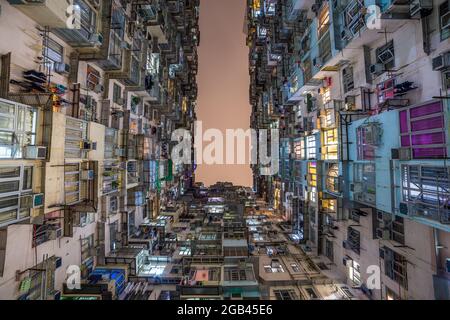 HONG KONG - 10TH APRIL 2017: Old apartment buildings on Hong Kong Island at night. Stock Photo