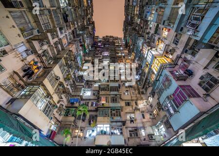 HONG KONG - 10TH APRIL 2017: Old apartment buildings on Hong Kong Island at night. Stock Photo