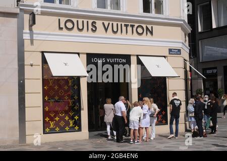 Copenhagen, Denmark. 02 August 2021, Shoppers waiting at Louis Vuitton store dueto in store due to covid-19 health issue. Stock Photo - Alamy
