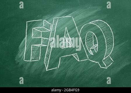 Frequently Asked Questions. Hand drawn text FAQ on blackboard Stock Photo