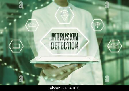 Conceptual display Intrusion Detection. Business concept monitors a network or systems for malicious activity Lady In Uniform Holding Tablet In Hand Stock Photo