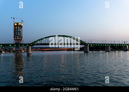 Belgrade, Serbia -  July 27, 2021: View of Belgrade Waterfront Luxury residences and business buildings and Bridge on the Sava river at night in Belgr Stock Photo