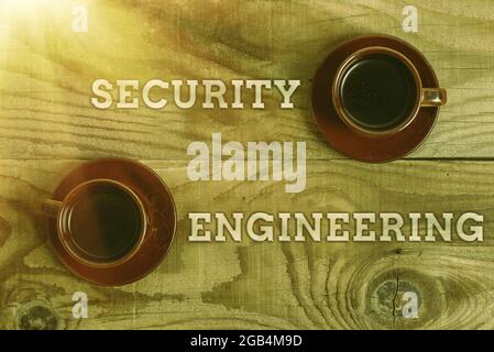 Hand writing sign Security Engineering. Word Written on focus on the security aspects in the design of systems Stack of Sample Cube Rectangular Boxes Stock Photo