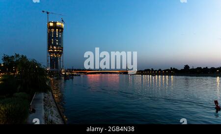 Belgrade, Serbia -  July 27, 2021: View of Belgrade Waterfront Luxury residences and business buildings and Bridge on the Sava river at night in Belgr Stock Photo